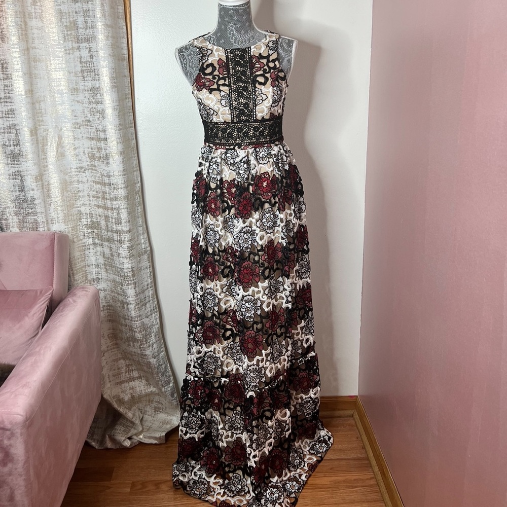 Monique Lhuillier gown with an all-over lace floral appliqué styling Gown